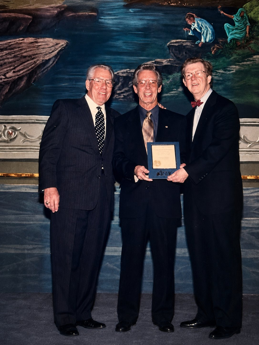 Charles Ernest Bailey with Aflac CEO Dan Amos and Director of Marketing Joe K.